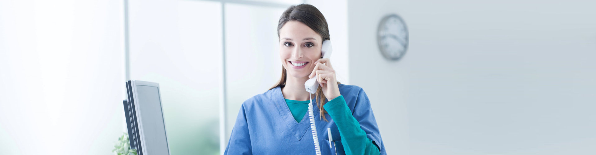 young female caregiver answering phone calls